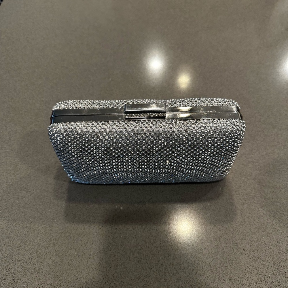 Silver clutch bag. Covered in crystals